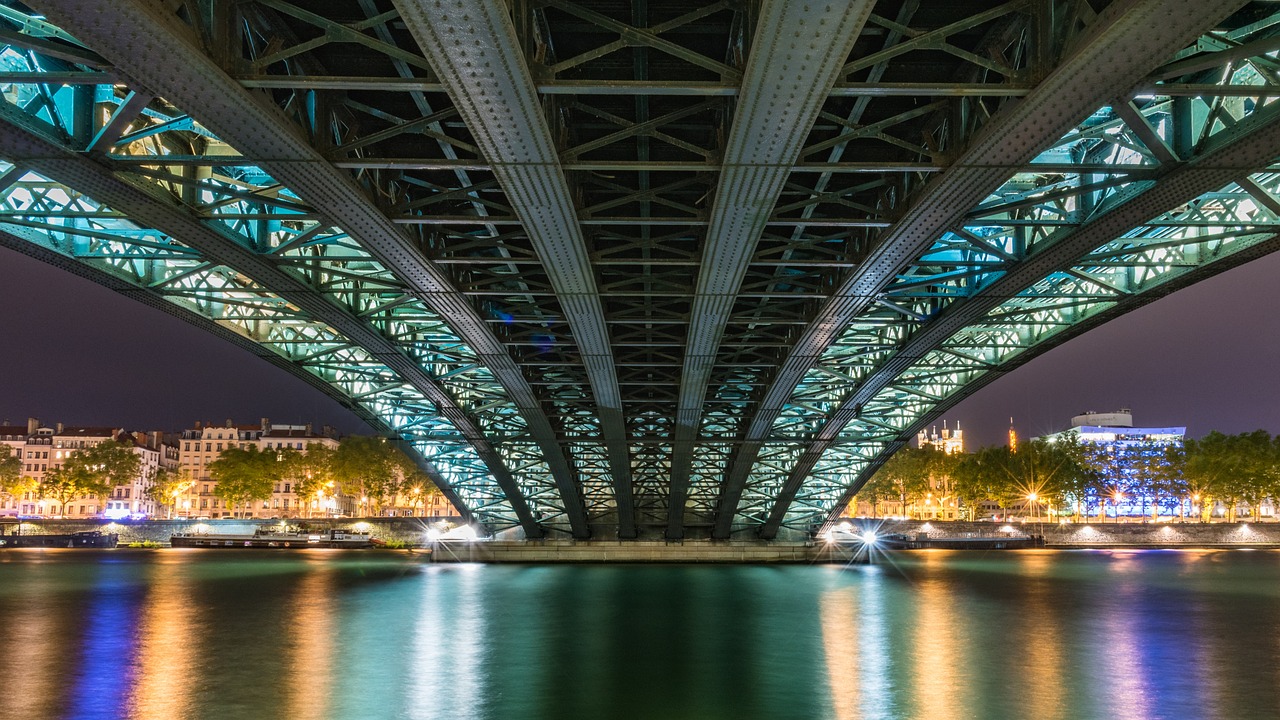 Lyon riverside at night with illuminated buildings