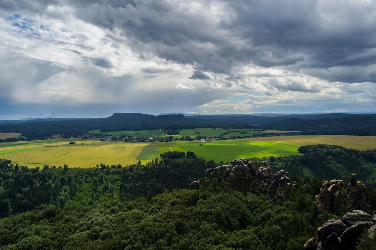 Sunset over Schrammsteine ridge with warm light on sandstone towers