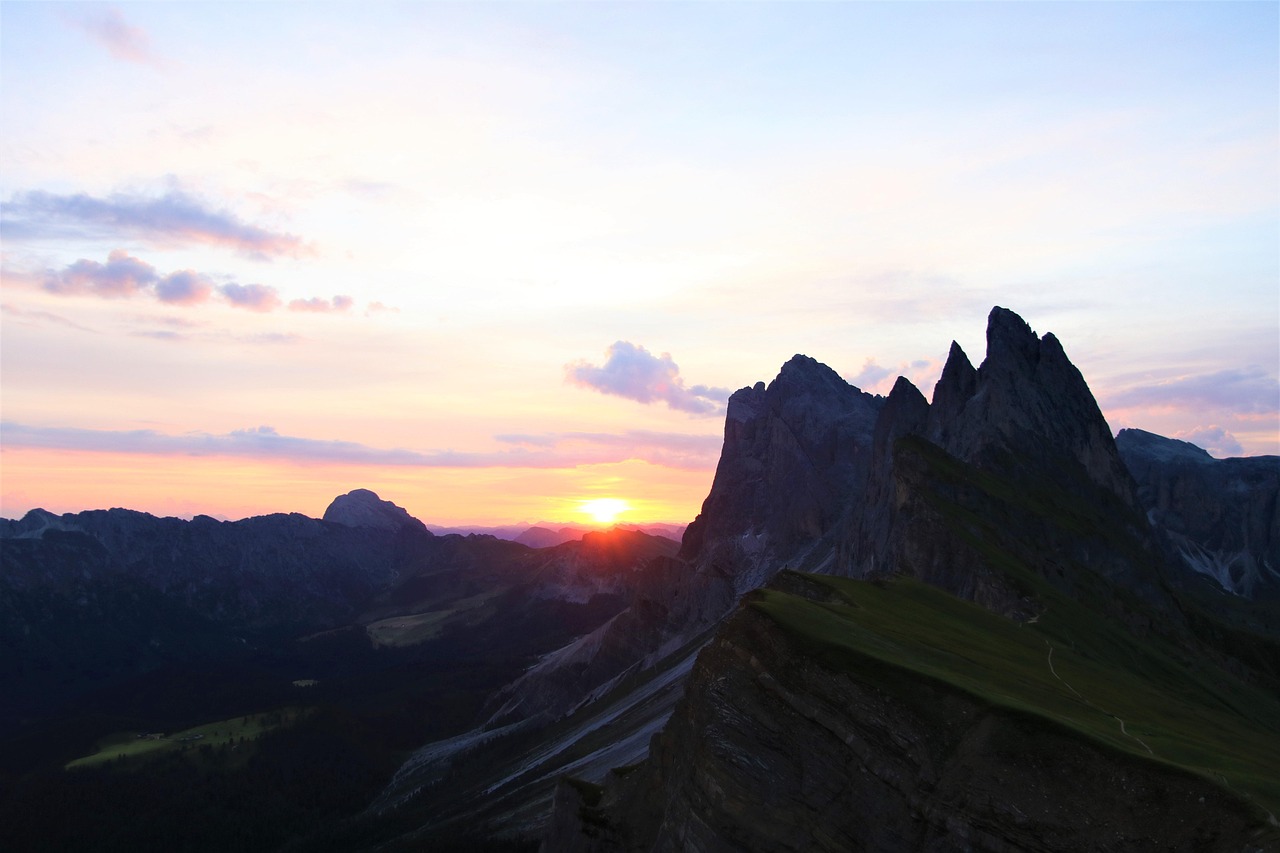 Morning light on Seceda ridge with hikers