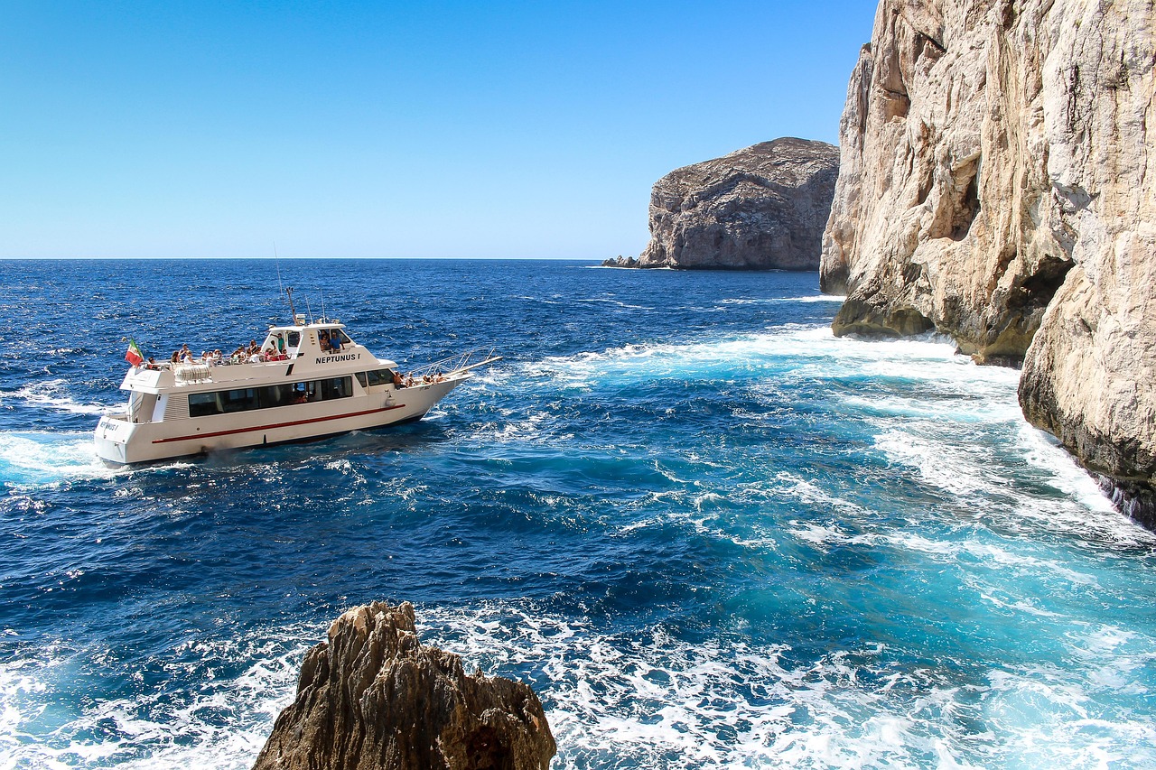 Boat trip off the coast of Sardinia with cliffs and sea