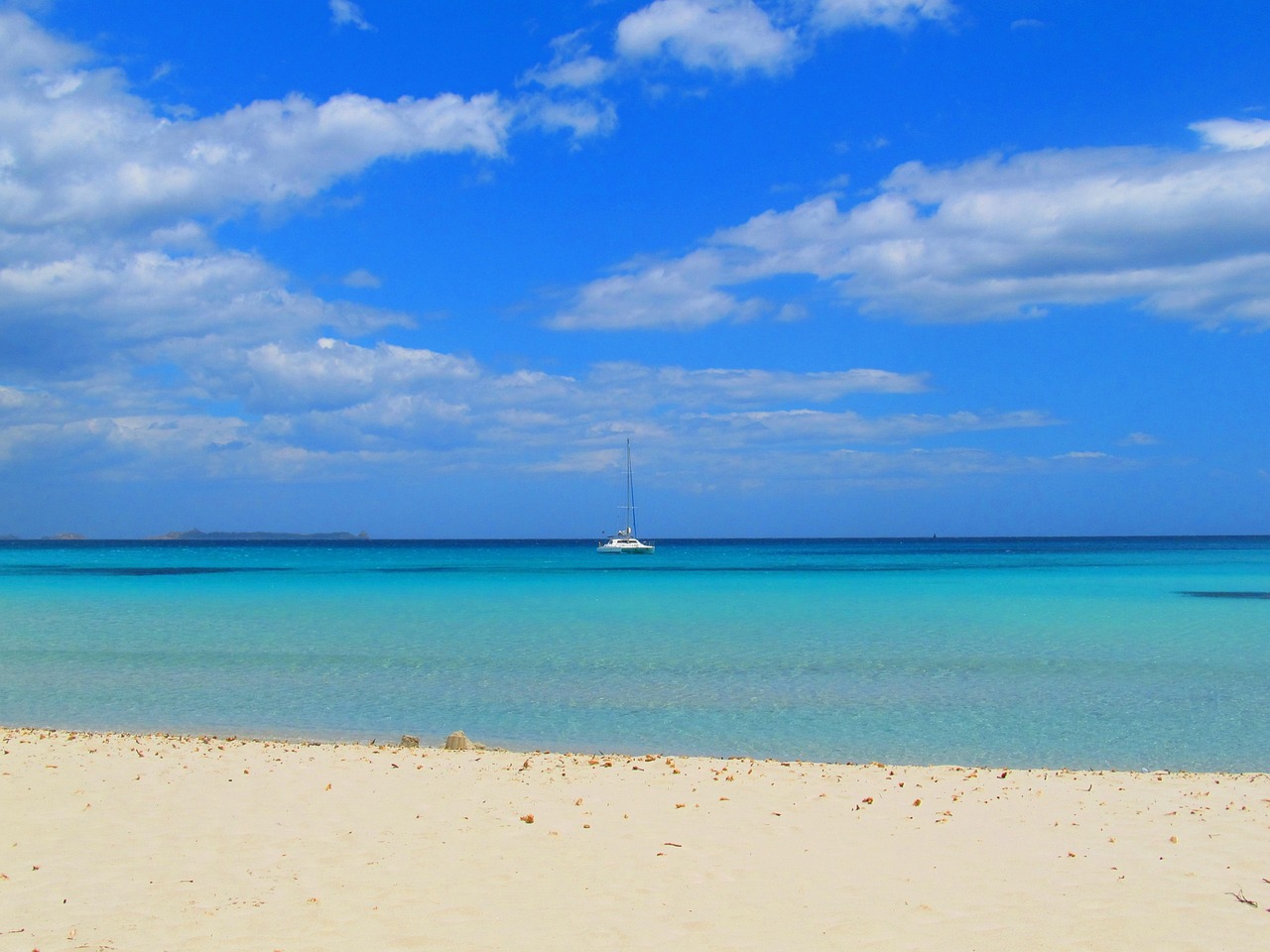 Villasimius beach with bay and boats